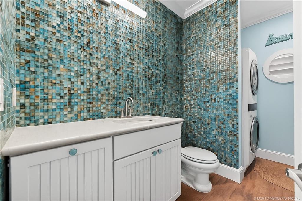 802 Southeast Portage Avenue Port St. Lucie, FL 34984 - Photo 35 of 48 a bathroom with a toilet and a shower curtain