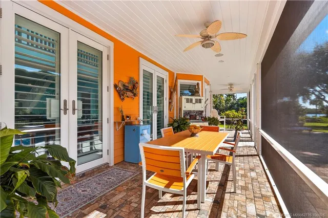 a view of a dinning tables and chairs in a patio