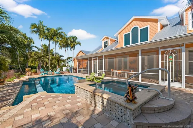a view of a swimming pool with a patio