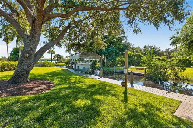 a view of a backyard with swimming pool