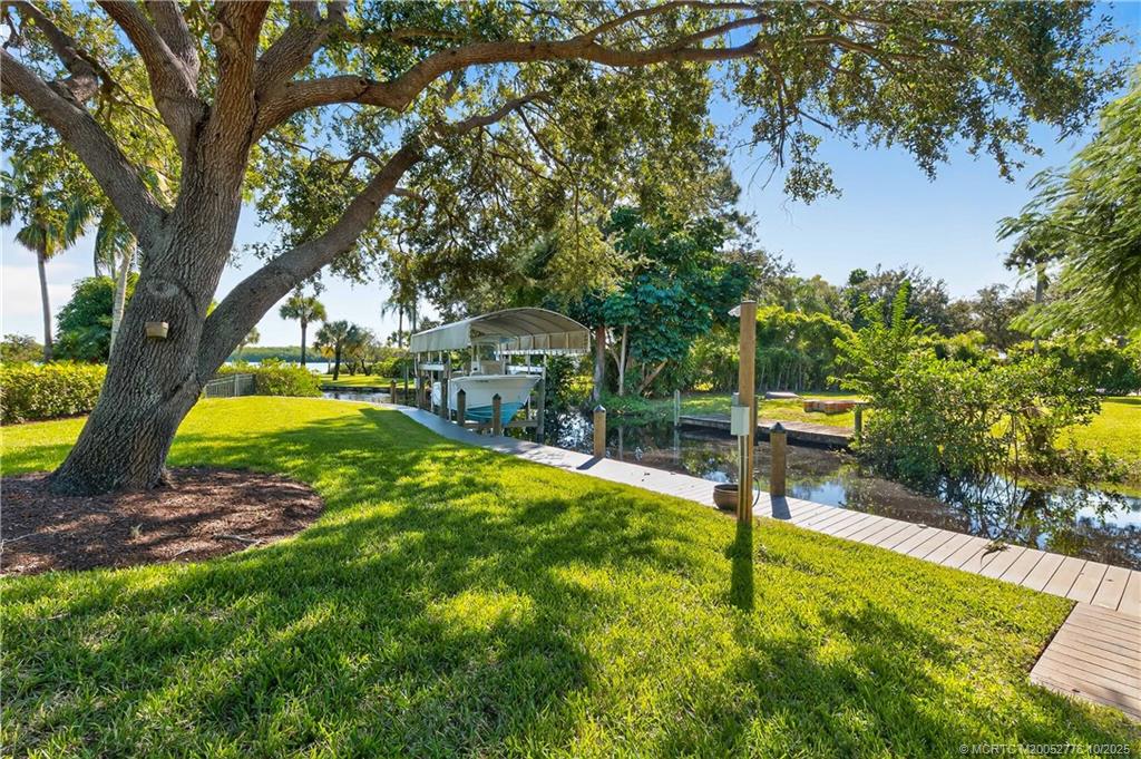 802 Southeast Portage Avenue Port St. Lucie, FL 34984 - Photo 4 of 48 a view of a backyard with swimming pool