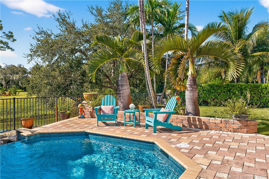 802 Southeast Portage Avenue Port St. Lucie, FL 34984 - Photo 41 of 48 a view of a water fountain with palm trees