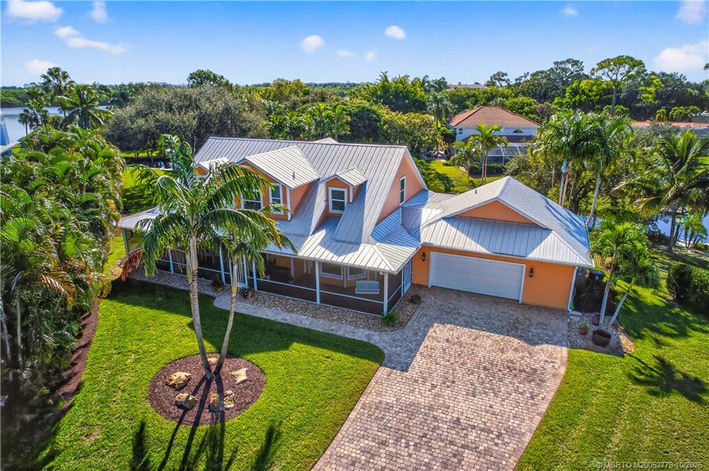 802 Southeast Portage Avenue Port St. Lucie, FL 34984 - Photo 6 of 48 an aerial view of a house with garden space and trees