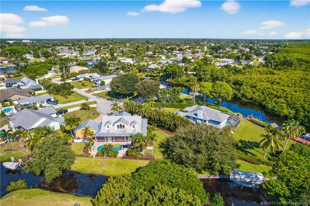 an aerial view of residential house with outdoor space and swimming pool