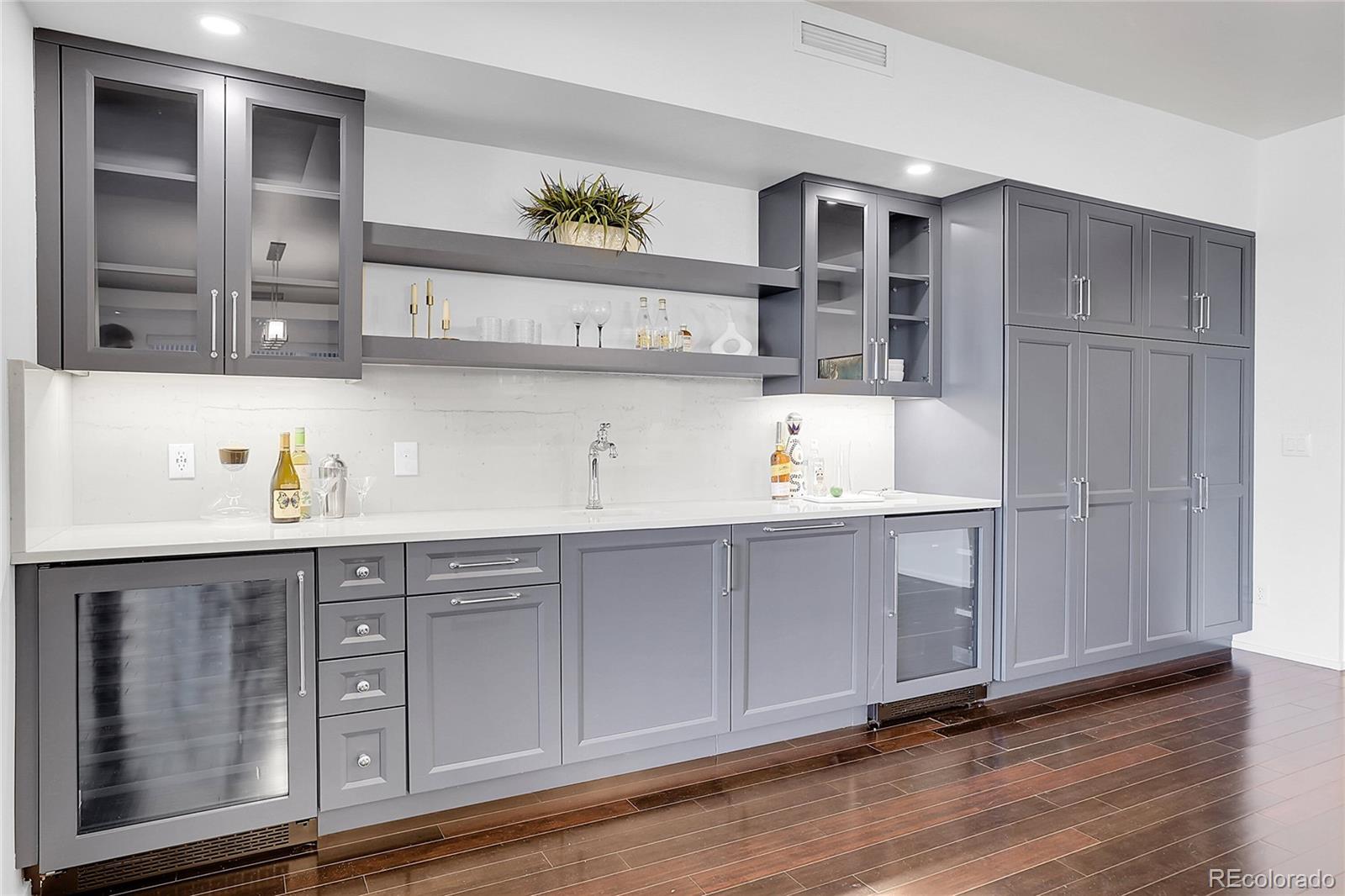 3131 Zuni Street, Unit 302 Denver, CO 80211 - Photo 16 of 36 a kitchen with stainless steel appliances a sink and cabinets