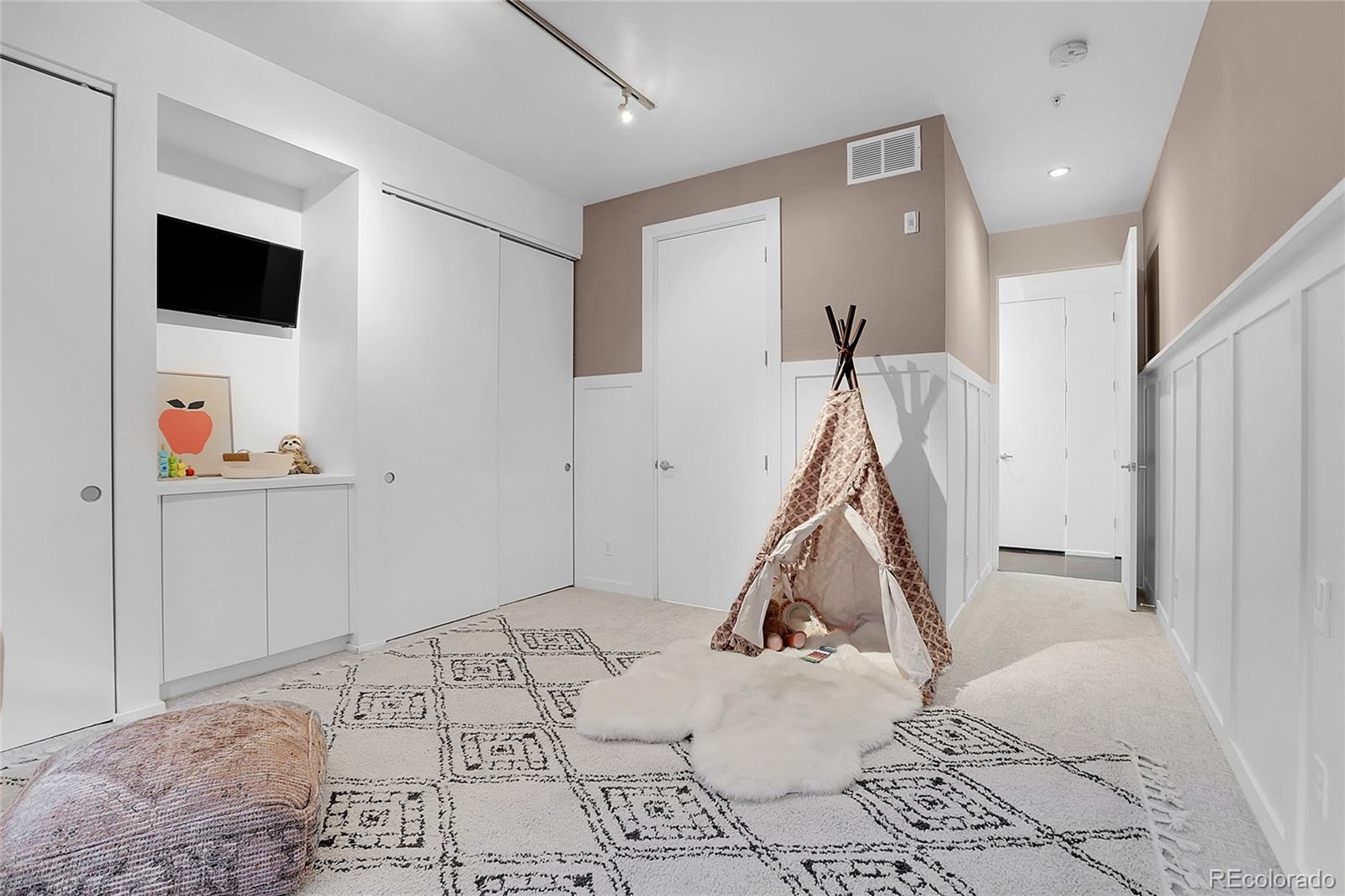 3131 Zuni Street, Unit 302 Denver, CO 80211 - Photo 23 of 36 a view of a livingroom with wooden floor and a hallway
