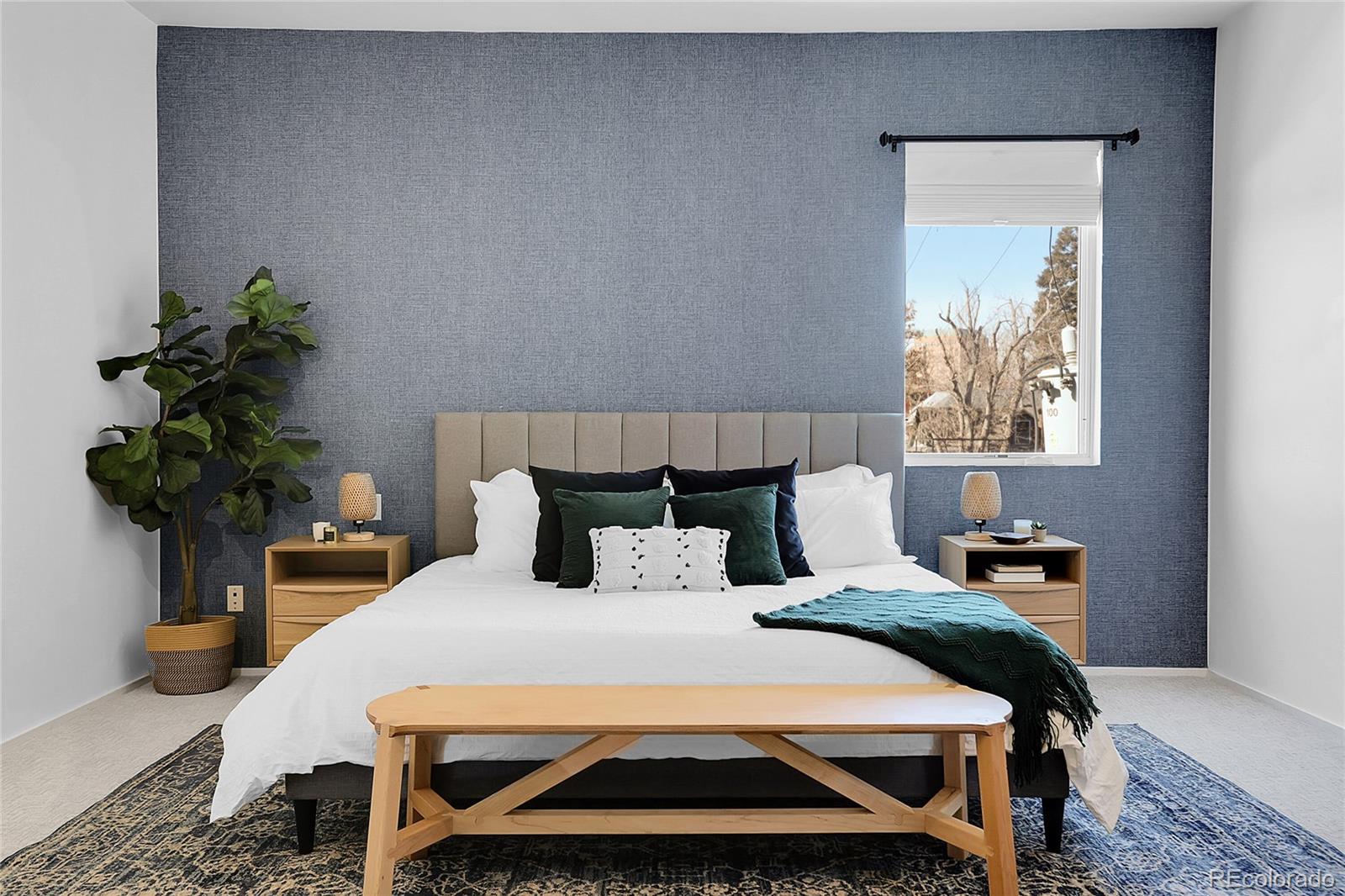3131 Zuni Street, Unit 302 Denver, CO 80211 - Photo 25 of 36 a bedroom with a bed and a potted plant