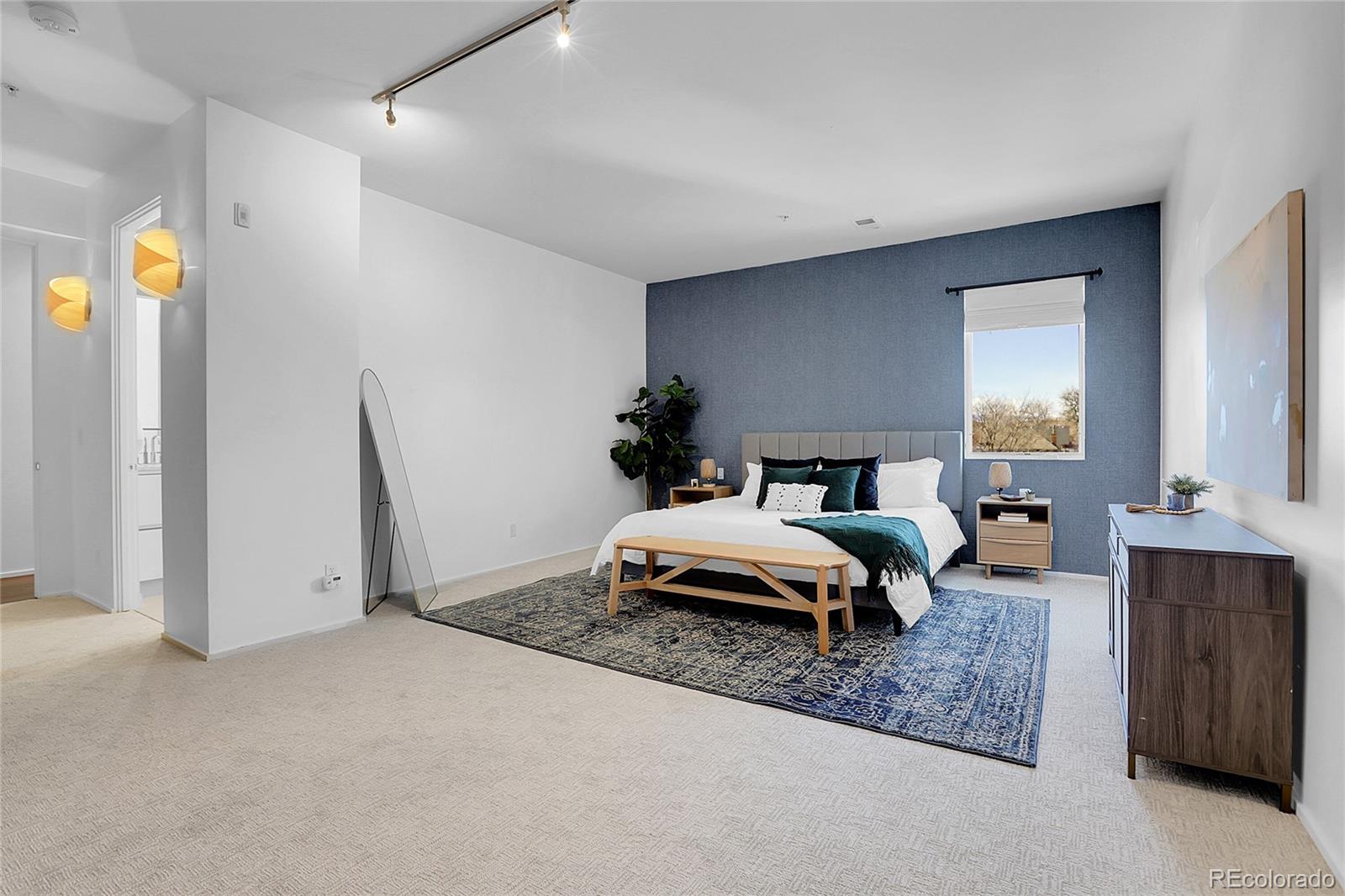 3131 Zuni Street, Unit 302 Denver, CO 80211 - Photo 26 of 36 a bedroom with bed and window