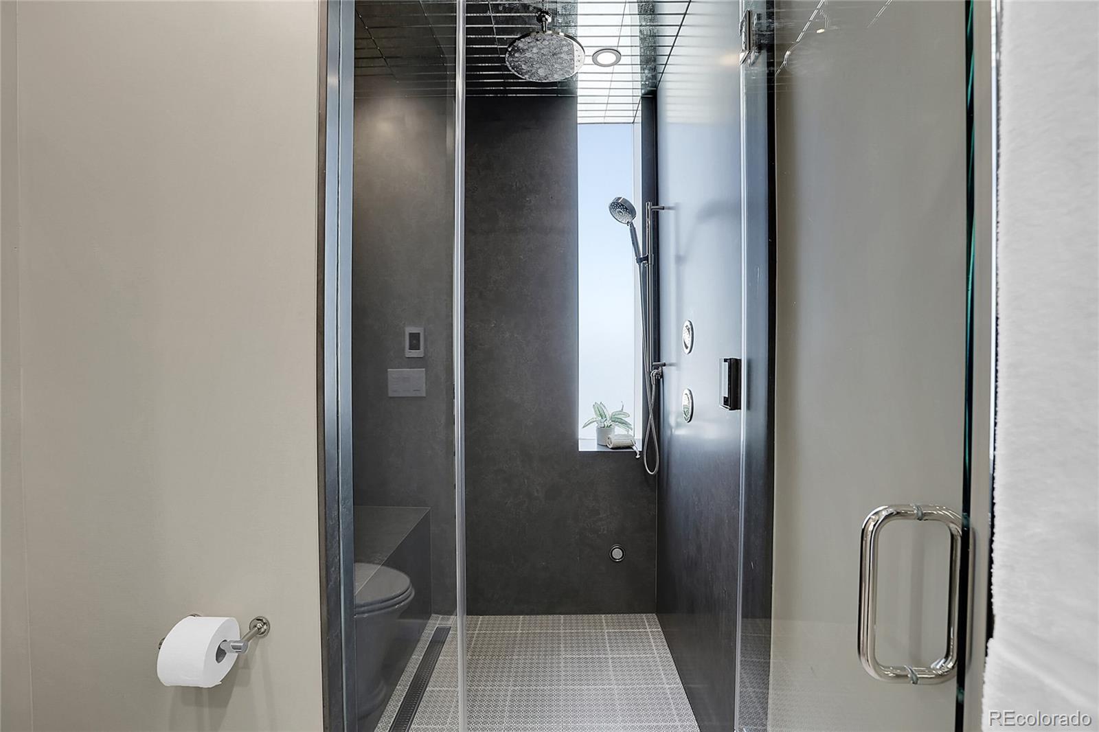 3131 Zuni Street, Unit 302 Denver, CO 80211 - Photo 28 of 36 a bathroom with a granite countertop shower