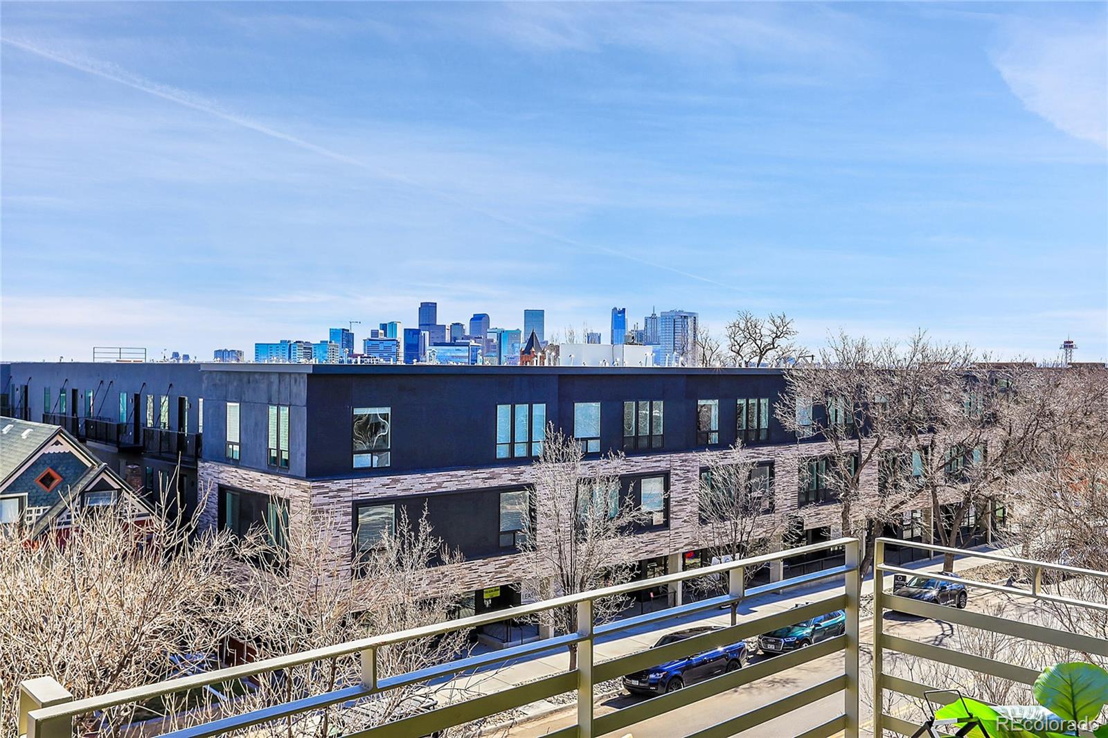 3131 Zuni Street, Unit 302 Denver, CO 80211 - Photo 33 of 36 a roof deck with tall buildings and city view