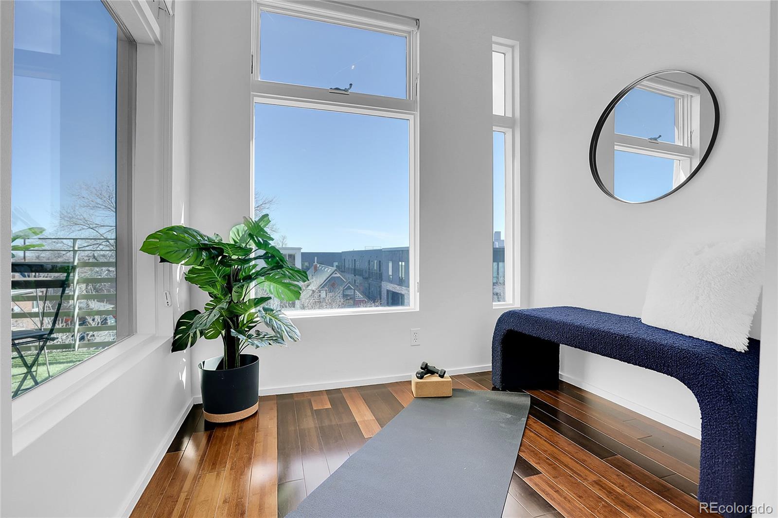 3131 Zuni Street, Unit 302 Denver, CO 80211 - Photo 6 of 36 a room with furniture and a potted plant