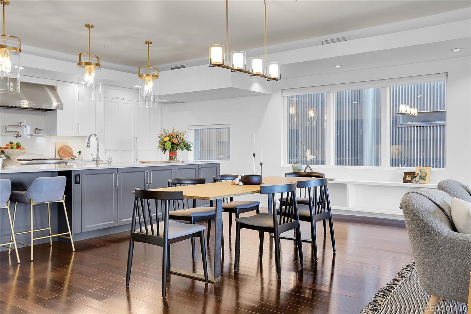 3131 Zuni Street, Unit 302 Denver, CO 80211 - Photo 7 of 36 a view of a dining room with furniture and chandelier