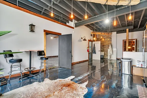 a view of an entryway with wooden floor