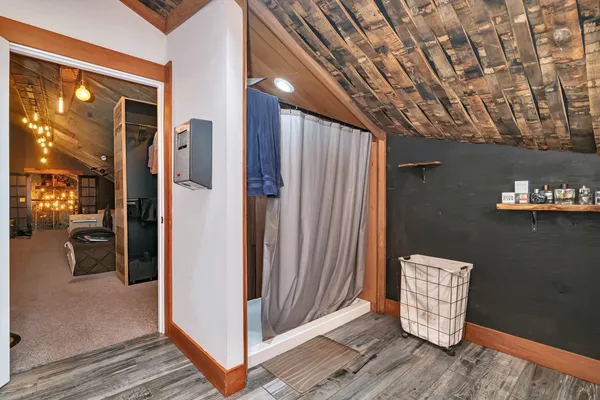 a bedroom with bed and window