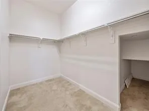 a view of an empty walk in closet