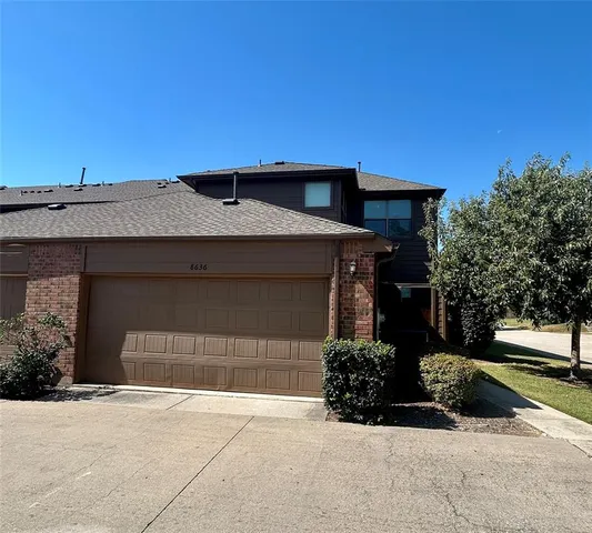 a front view of a house with a garage