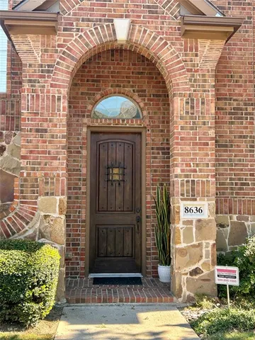 a view of a brick building with a door
