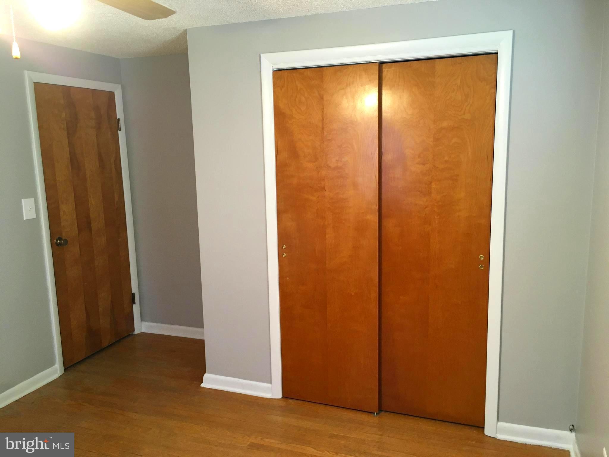 8103 Edwill Avenue Rosedale, MD 21237 - Photo 13 of 31 an empty room with sliding door