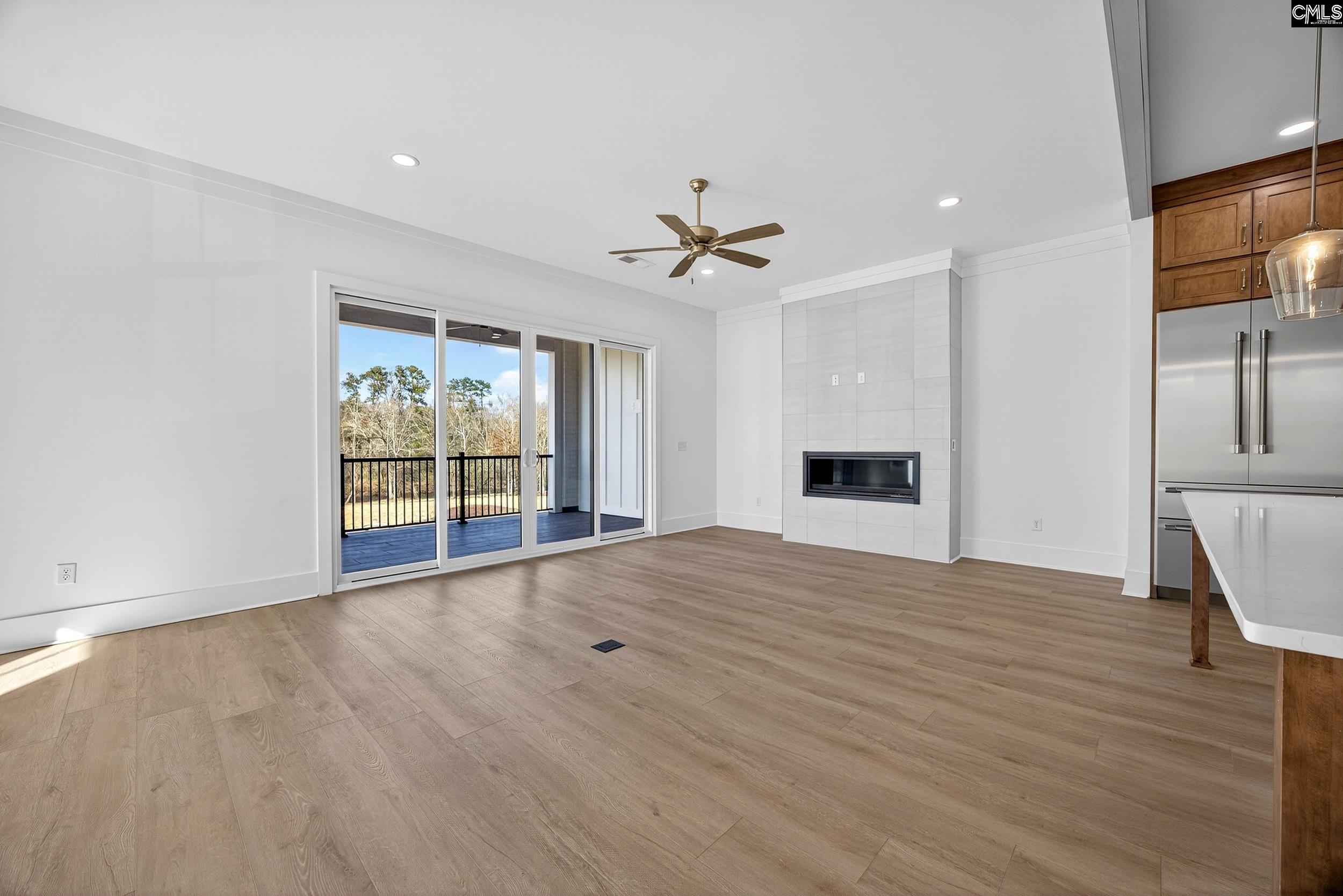 1318 Long Grove Way Lexington, SC 29072 - Photo 26 of 90 a view of an empty room with a window and wooden floor
