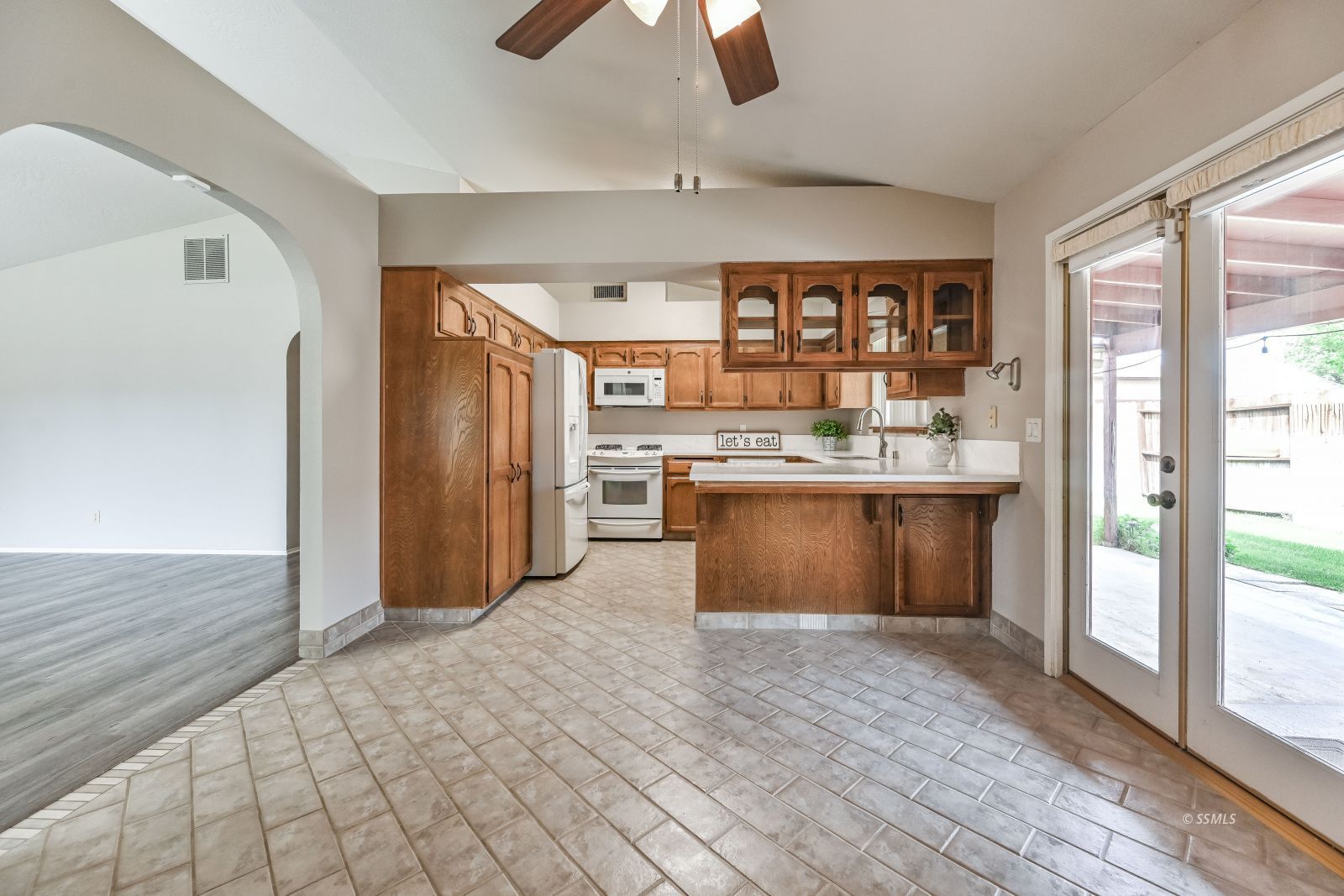 131 Chambers Street Ridgecrest, CA 93555 - Photo 8 of 28 a large kitchen with stainless steel appliances granite countertop a refrigerator and a sink