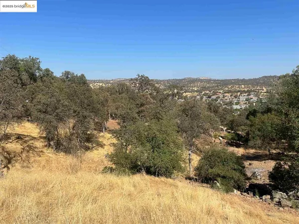 a view of mountain view with mountains in the background