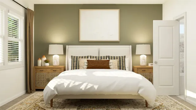 a bedroom with a bed and a night stand