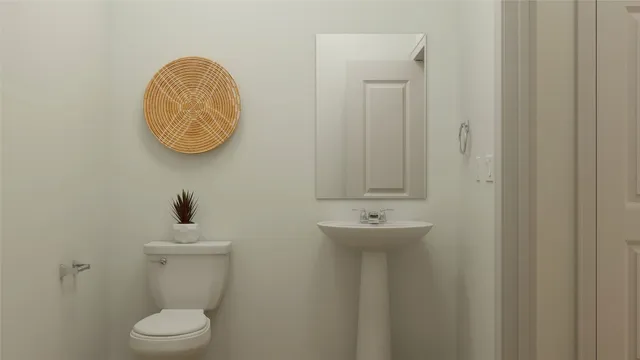 a bathroom with a toilet and a sink