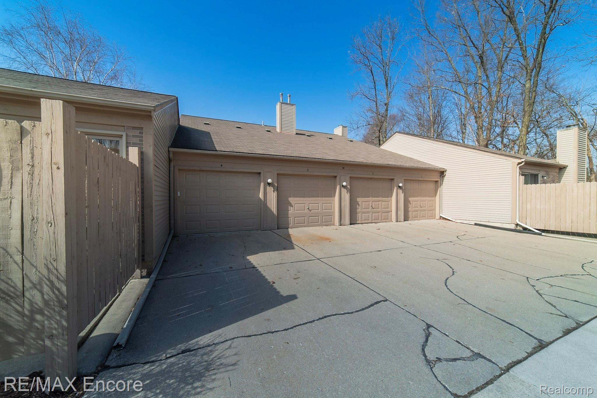 90 Pine Tree Ridge, Unit 4 Waterford, MI 48327 - Photo 18 of 18 Attached over sized one car garage.