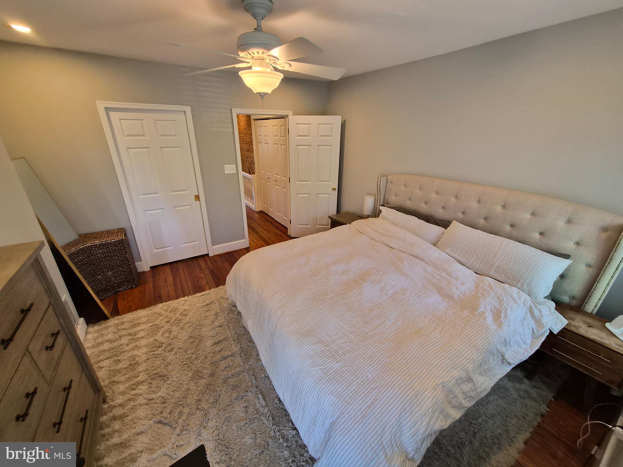1601 Belt Street Baltimore, MD 21230 - Photo 19 of 30 a bedroom with a bed and a chandelier