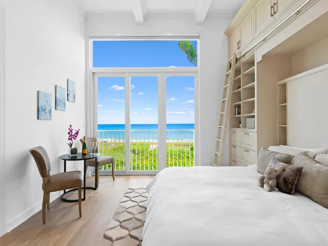 a bedroom with a bed and a chair