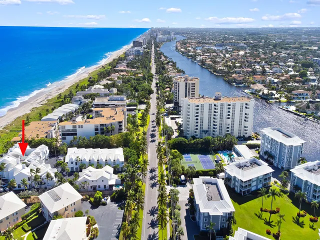 a view of a house with a patio and garden