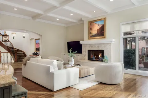 a bedroom with a large bed and a painting on the wall