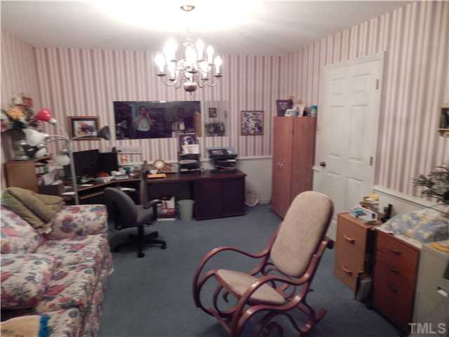 2539 Burton Road Durham, NC 27704 - Photo 8 of 18 a view of a livingroom with furniture and a window