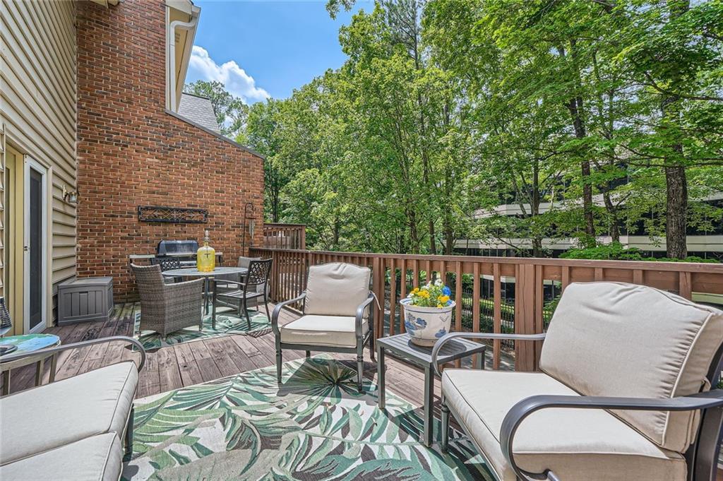 40 Ivy Chase Northeast Atlanta, GA 30342 - Photo 12 of 38 a balcony with furniture and a potted plant
