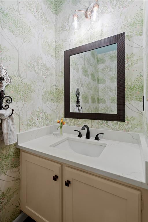 40 Ivy Chase Northeast Atlanta, GA 30342 - Photo 16 of 38 a bathroom with a sink and a mirror