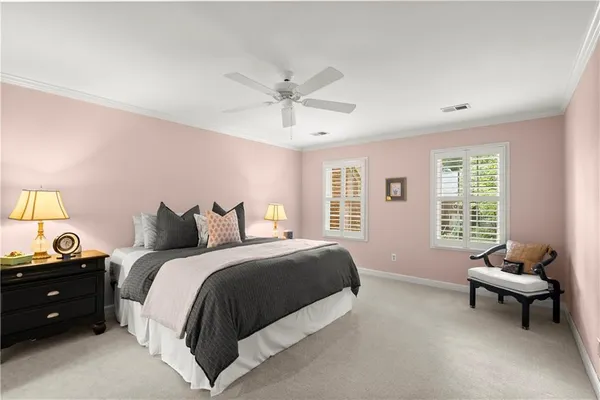 a spacious bedroom with a bed and a window