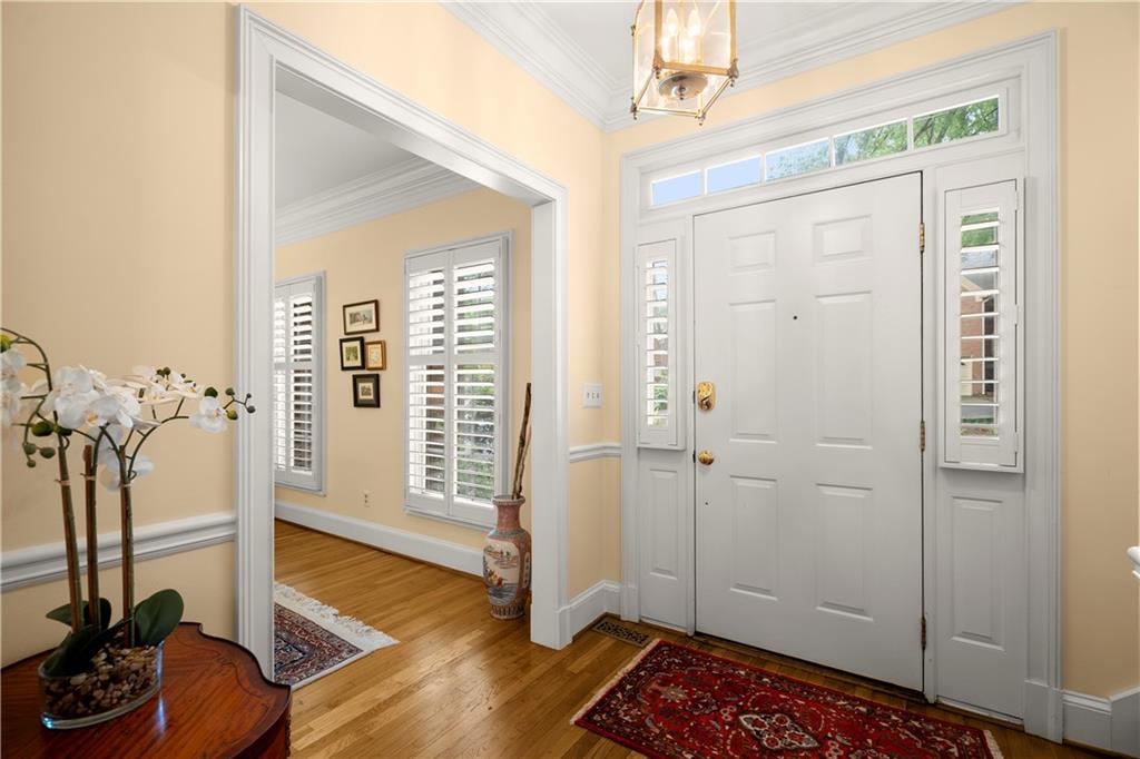 40 Ivy Chase Northeast Atlanta, GA 30342 - Photo 2 of 38 a view of a livingroom with wooden floor and a staircase