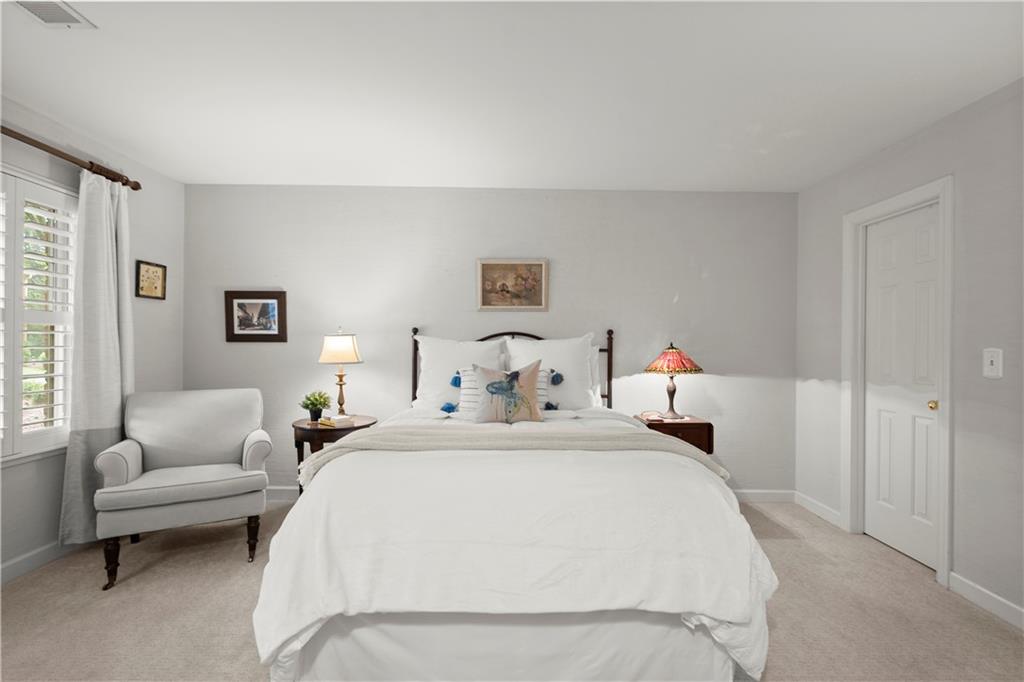 40 Ivy Chase Northeast Atlanta, GA 30342 - Photo 25 of 39 a bedroom with a bed and a couch