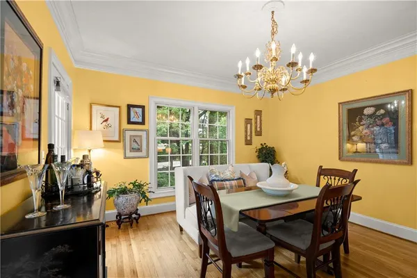 a view of a dining room with furniture window and outside view