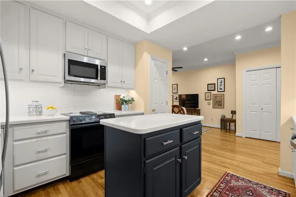 a kitchen with a sink stove and microwave