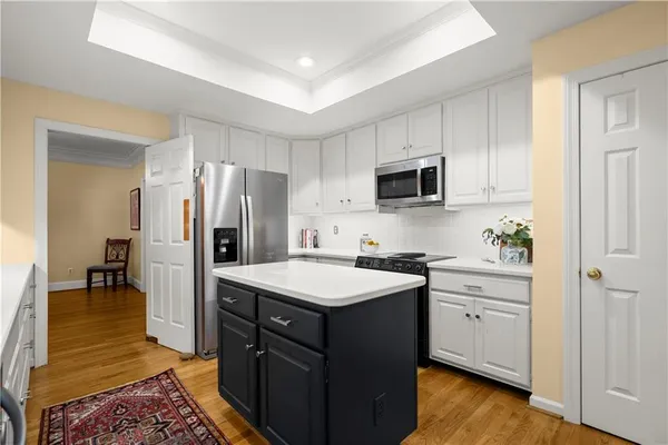 a kitchen with a sink stove and refrigerator