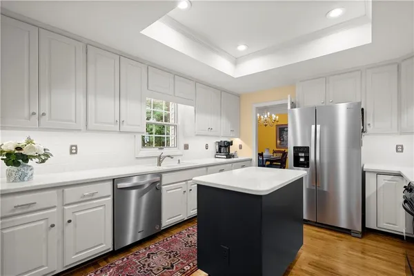 a kitchen with a sink stove and refrigerator
