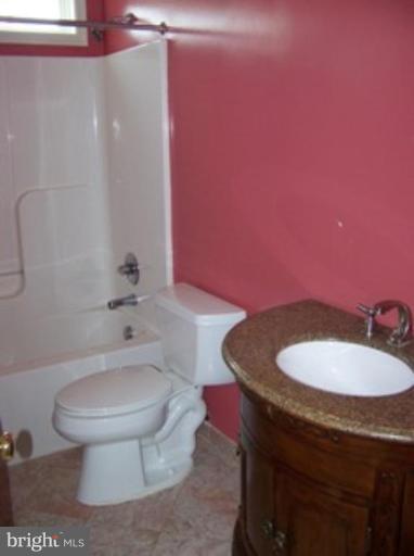 4 Gallery Road Stafford, VA 22554 - Photo 17 of 21 a bathroom with a toilet a sink and mirror