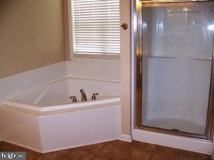 4 Gallery Road Stafford, VA 22554 - Photo 10 of 21 a bathroom with a bathtub and shower