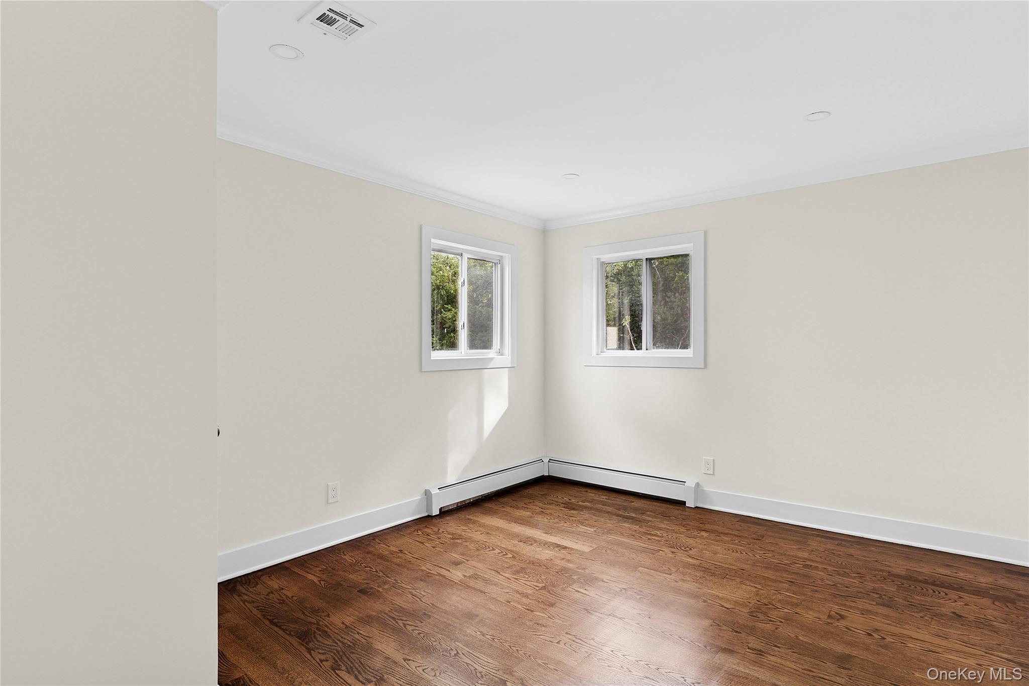 21 A Neulist Avenue Port Washington, NY 11050 - Photo 13 of 17 an empty room with a workspace