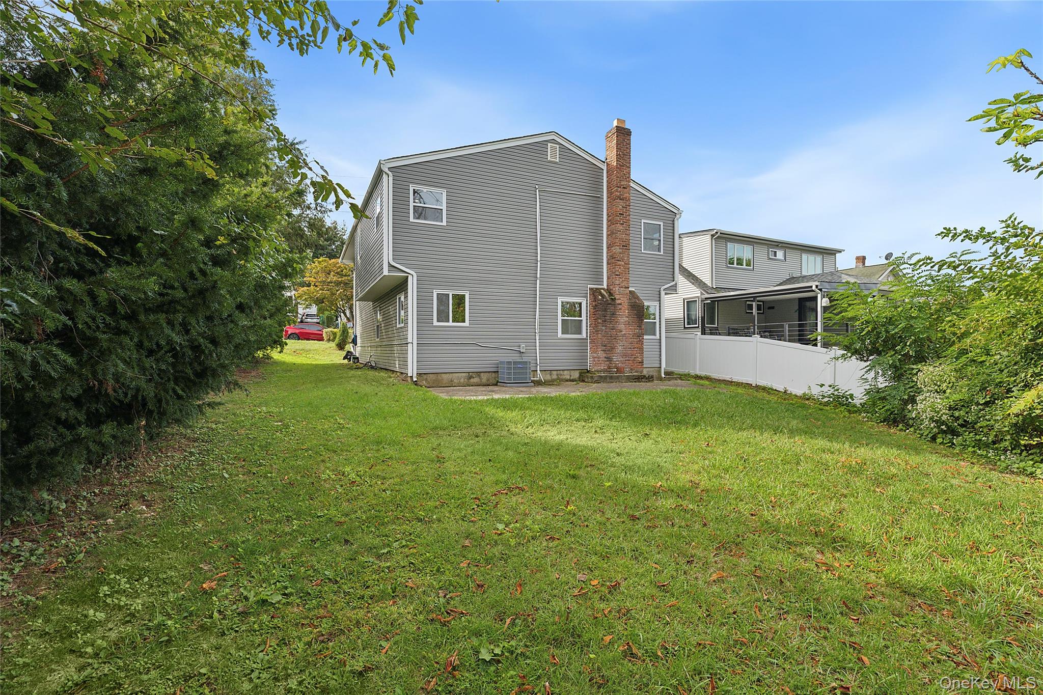 21 A Neulist Avenue Port Washington, NY 11050 - Photo 17 of 17 a front view of house with yard and green space