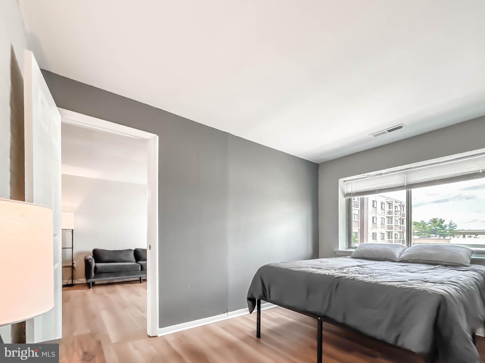 130 Slade Avenue, Unit 414 Baltimore, MD 21208 - Photo 44 of 48 a bed room with a bed and a window