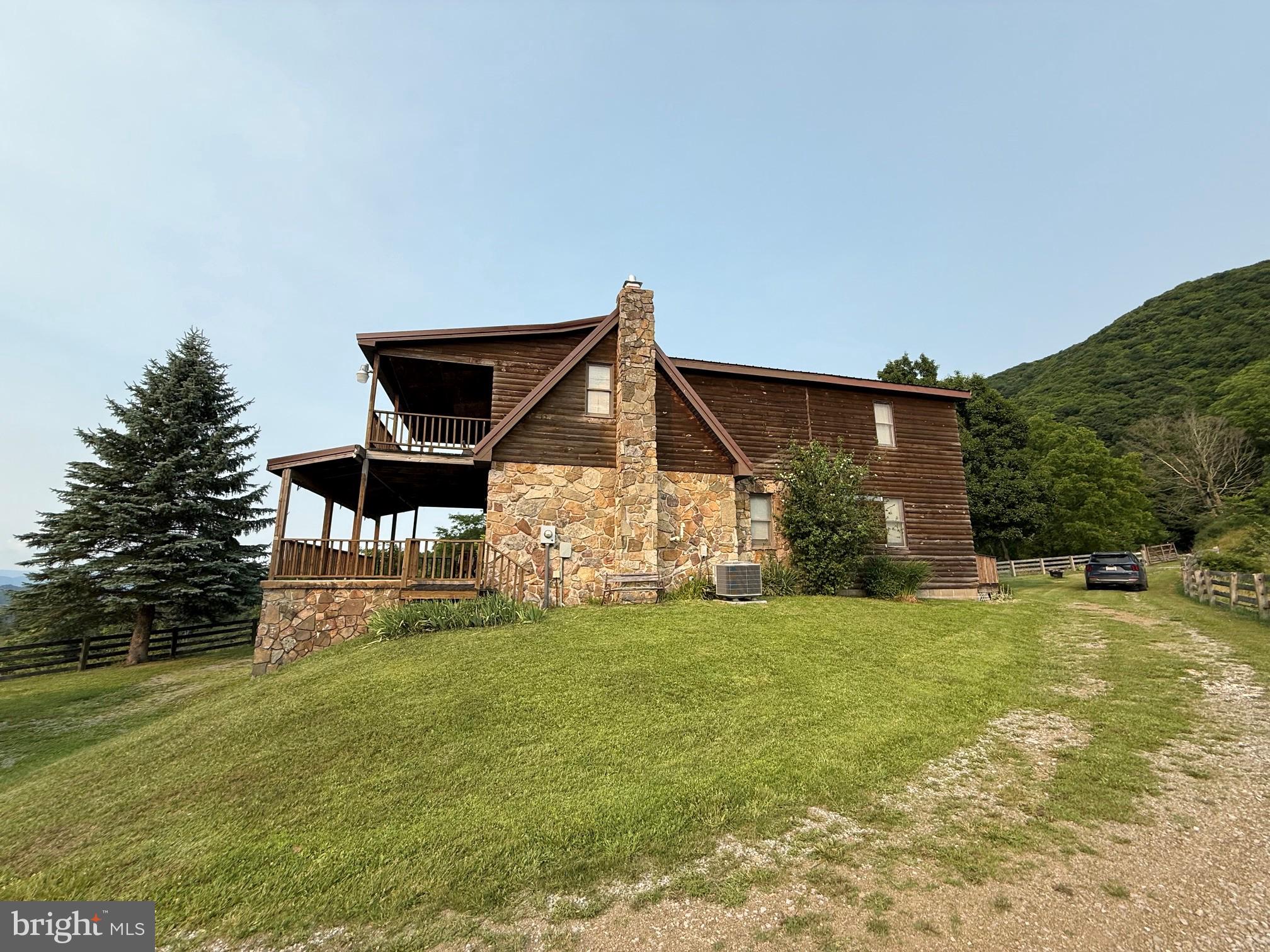 1492 Dice Warner Road Circleville, WV 26804 - Photo 5 of 36 Charming hillside retreat with views.