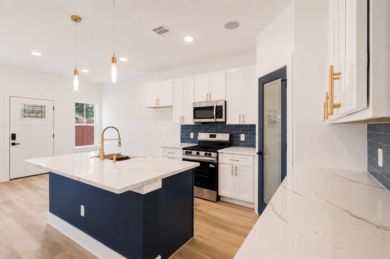 4606 Mallow Street, Unit B Houston, TX 77051 - Photo 11 of 25 a kitchen with a sink dishwasher a stove and a refrigerator with wooden floor