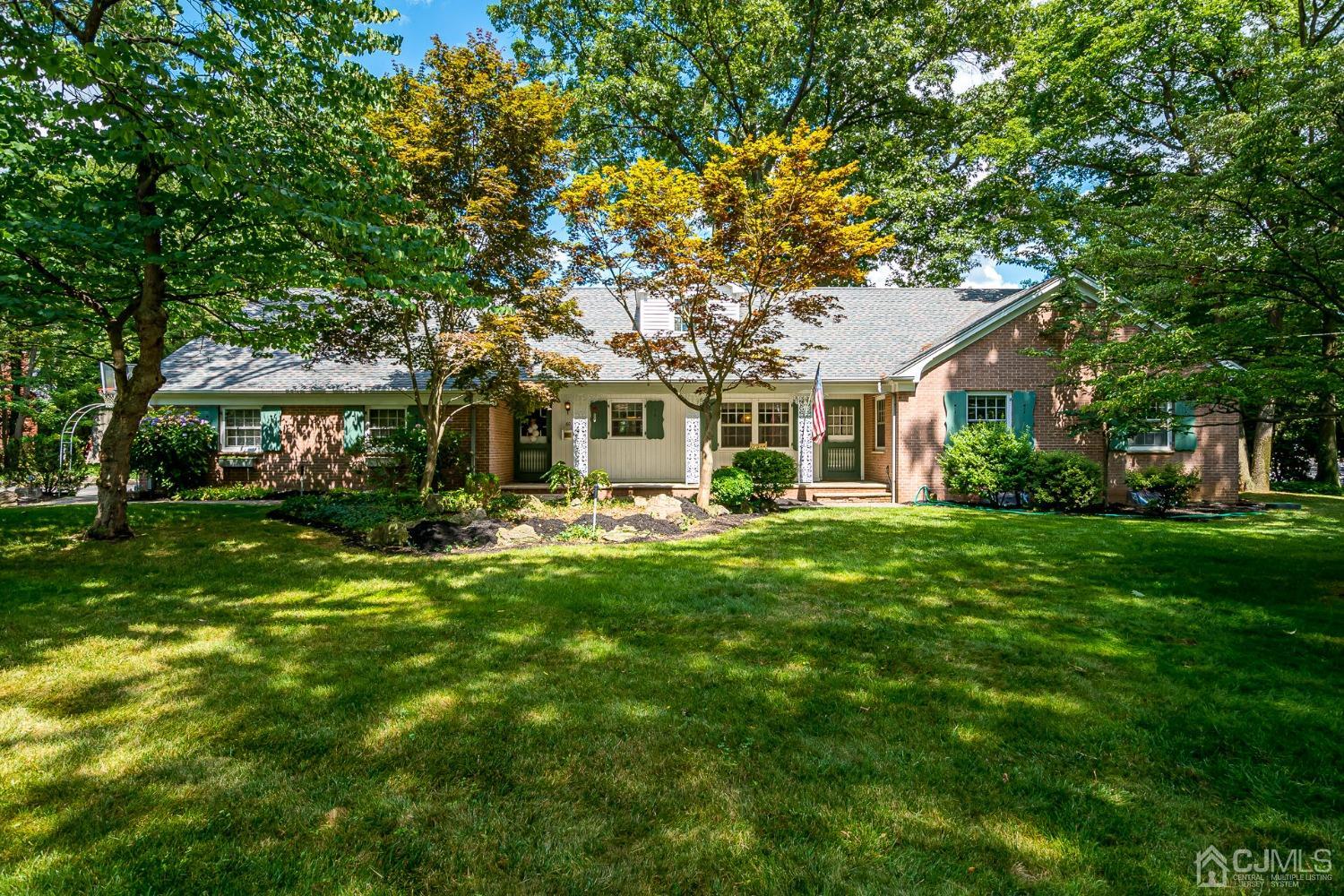 60 Buchanan Road Edison, NJ 08820 - Photo 2 of 54 a front view of a house with a garden